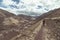 Tourist exploring the Inca Trails and the majestic terraces of Pisac, Sacred Valley, major travel destination in Cusco region, Per