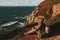 Tourist exploring Portugal. Cabo da Roca ocean and mountains view, authentic lifestyle capture