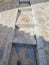 Tourist feet following ceramic tile footprint used to guide visitors, Comares, Malaga, Spain