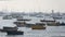 Tourist and fisher boats by the harbour