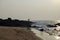 Tourist fishing on the rocky beach of Anjuna,Goa,India