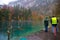 Tourist fishing for trout at Blausee lake