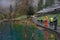 Tourist fishing for trout at Blausee lake