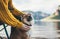 Tourist friend girl together tender dog on background mountain, female hands hugging puppy pet on lake shore nature trip, friend