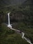 Tourist on giant swing adventure ride at Manto de la novia Bridal Veil waterfall Pastaza river Banos Tungurahua Ecuador