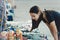 Tourist girl examines souvenirs sold on the street in the city of Vyborg, Leningrad region