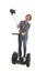 Tourist girl taking selfie photo with mobile phone while riding on segway
