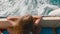 Tourist girl traveling on speed boat at summer day overhead view. Traveling girl relaxing on sailing board, trail water