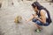 Tourist giving nuts to a monkey