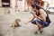 Tourist giving nuts to a monkey