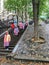 Tourist group in colorful raincoats descends outdoor stairs near Montmartre funicular