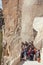 Tourist group curiously waiting in the queue at the entrance of a cave in Cappadocia