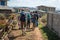 A tourist group hike into a rural farm village in Myanmar