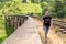 A tourist guy walks along the famous nine-arch railway bridge in Sri Lanka. Tourism in picturesque places