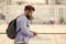 Tourist handsome thoughtful hipster backpack. Man with beard and rucksack explore city. Travelling concept. Tourist on