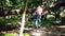 Tourist hanging a backpack on a tree