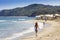 Tourist having a morning walk by Sayulita Beach in Mexico