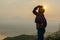 Tourist high in the mountains sunset sun fog tops of the carpathians