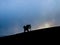 Tourist hiker acting on top of mountain