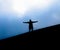 Tourist hiker acting on top of mountain