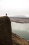 Tourist hiker person standing on massive panoramic rock cliff edge viewpoint Gaukshofdi at Thjorsa river in Iceland