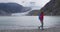 Tourist hiking woman hiker in Alaska walking by Mendenhall Glacier