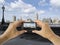 Tourist holds up camera mobile at big ben