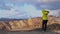 Tourist on Iceland looking at Landmannalaugar nature landscape