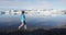 Tourist in Iceland nature landscape walking by Jokulsarlon glacial lagoon