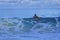 tourist jump in the Waves in Anse Coco in La Digue, Seychelles