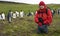 Tourist with King Penguins - Falkland Islands