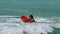 Tourist with a knee board at the beach