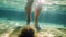 Tourist legs step on sea urchin, underwater view of woman legs near sea urchin on seabed