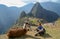 Tourist and llama in Machu Picchu