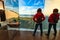 Tourist look out at landscape from mirrored toilet, Andoya Norway