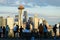 Tourist look over the city of Seattle and the Space Needle as sunset approaches