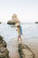 Tourist looking female model walking on Beach Barranco das Canas near Portimao, Portugal