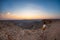 Tourist looking at the Fish River Canyon, scenic travel destination in Southern Namibia. Ultra wide angle view from above, colorfu