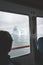 Tourist Looking at Glaciers and icebergs Mountains on a boat in west greenland. Iceberg in sea and ocean. Overcast day