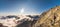 Tourist Looking at Mountains with Inversion at Sunset