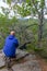 Tourist looking out from the Barron Canyon trail in Late summer in Algonquin