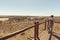 Tourist looking at panorama with binocular from viewpoint over the Mapungubwe National Park, travel destination in South Africa.