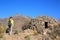 Tourist looking at pre-Incan round house named colca near Chivay in Peru