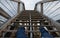 The tourist lookout tower slides dangerously down the wooden stairs in winter. hiker in jeans fell from the skin and injured lying