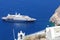 Tourist luxury cruise ship moored at the port of fira city Santorini Greek island Greece in the aegean sea