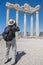 Tourist makes a photo of ancient roman ruins of Apollo temple in