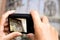 Tourist makes a photo of entrance door of western facade of the Basilica of the Annunciation, Church of the Annunciation, Nazareth