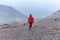 Tourist man adventurer backpacker walking storm mountain peak, Peru