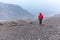 Tourist man adventurer backpacker walking storm mountain peak, Peru