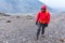 Tourist man adventurer backpacker walking storm mountain peak, Peru